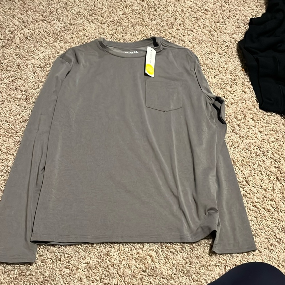 Long sleeve gray shirt.